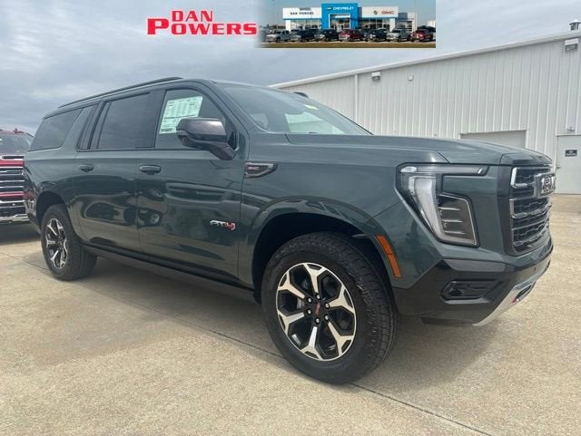 2026 GMC Yukon XL AT4 in Midnight Pine — front three-quarter view