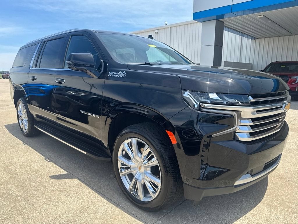 2024 Chevrolet Suburban High Country in Black — front three-quarter view