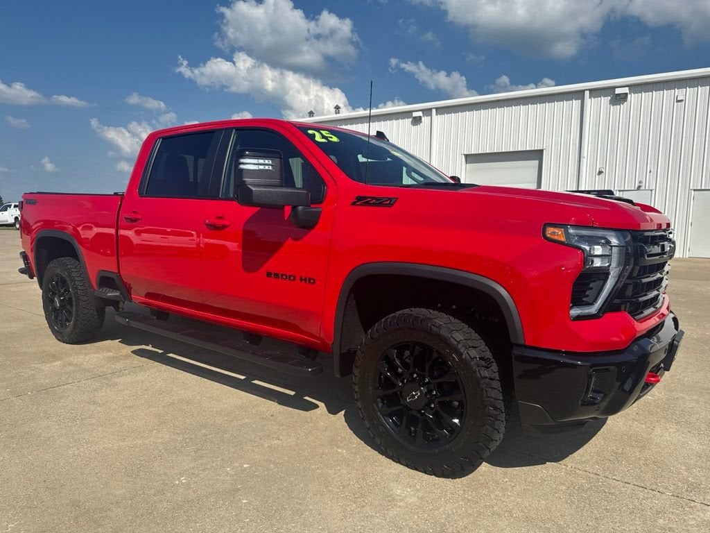 2025 Chevrolet Silverado 2500 HD LT in Red Hot — front three-quarter view
